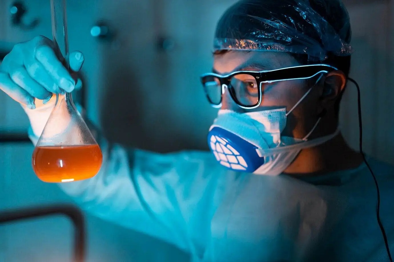 young male researcher carrying out scientific experiment 1153 4517